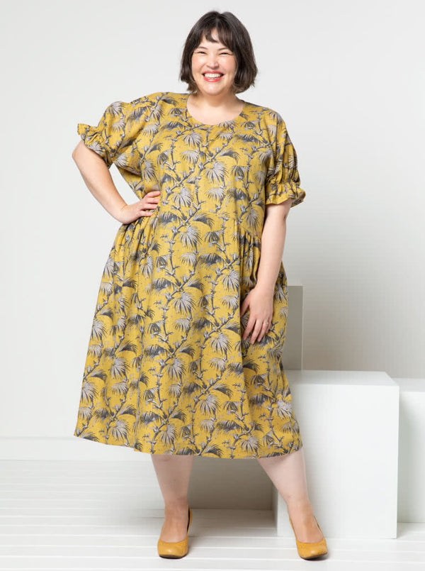 Elegant Eileen Dress pattern with shirred sleeve detail, gathered side waist, and round neckline, offering a blend of classic and modern style.