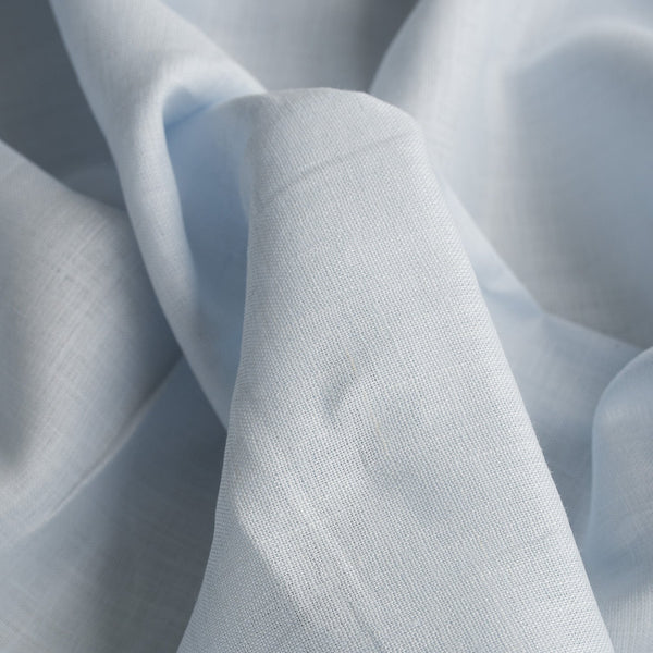 Very light washed blue linen fabric with a durable tight weave, ideal for summer garments
