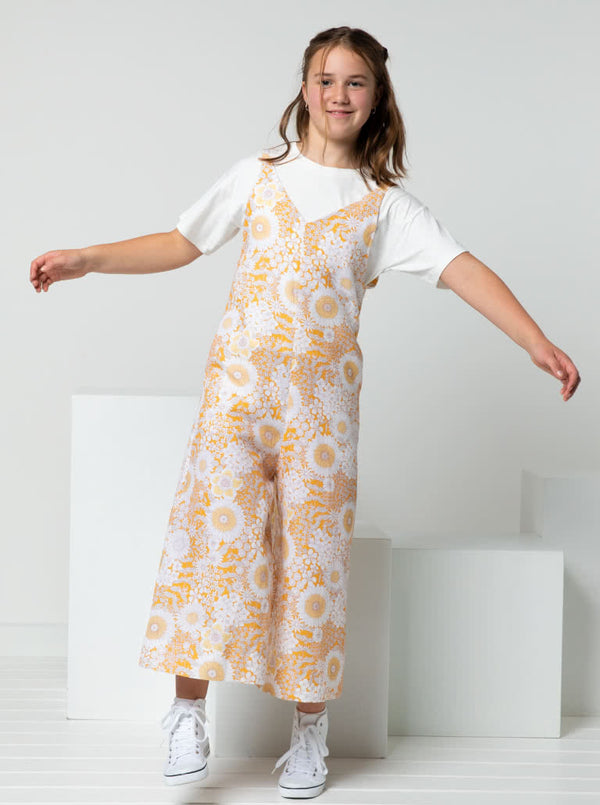 A fashionable Norman Teens jumpsuit sewing pattern with a “V” neck and wide legs, designed for comfort and style in teen sizes.