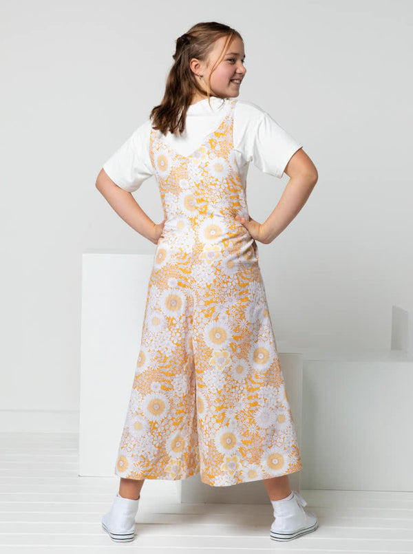 A fashionable Norman Teens jumpsuit sewing pattern with a “V” neck and wide legs, designed for comfort and style in teen sizes.