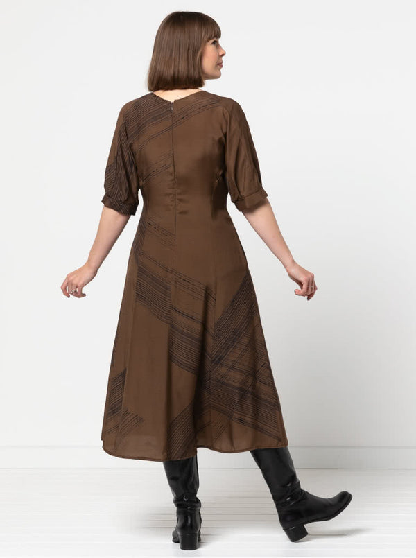 Elegant Penelope dress sewing pattern with a princess line, round neck, and unique elbow-length sleeves with tucks and gussets, suitable for silk, rayon, or linen