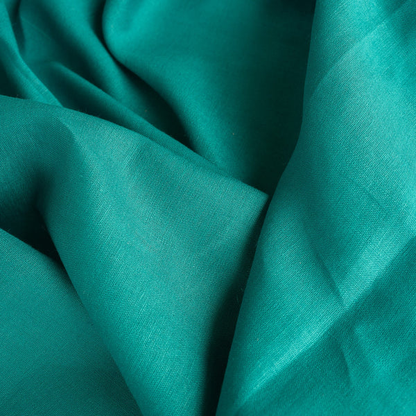 Persian Green 100% linen fabric, perfect for creating vibrant summer shirts, dresses, skirts, and loose pants.