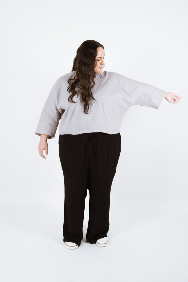 Stylish Pinnacle Curve Top/Sweater sewing pattern featuring a cropped oversized fit with two front triangle panels, available in variations with Deep V or Round necklines