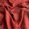 Rich red velvet two-tone linen fabric with a unique denim-like texture, ideal for crafting stylish and elegant garments.