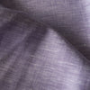 Yarn-dyed Lilac Fizz linen fabric with white and lilac threads, featuring natural slubs for a textured look and feel.