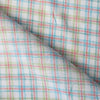 Colorful Carnival Check Linen Fabric featuring a mix of aqua, green, and red threads on white, suitable for a variety of light and airy garments.