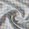 Colorful Carnival Check Linen Fabric featuring a mix of aqua, green, and red threads on white, suitable for a variety of light and airy garments.