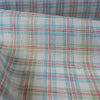 Colorful Carnival Check Linen Fabric featuring a mix of aqua, green, and red threads on white, suitable for a variety of light and airy garments.