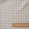 Country Lane Plaid Linen Fabric featuring moss green, light yellow, and brown threads on a cream background, ideal for creating small-scale, fine plaid garments.