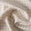 Country Lane Plaid Linen Fabric featuring moss green, light yellow, and brown threads on a cream background, ideal for creating small-scale, fine plaid garments.