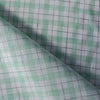 Summery Country Mint Check Linen Fabric with moss green and soft grey threads on a cream base, offering a smooth feel and gentle drape for comfortable wear.