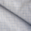 Rustic light check linen fabric with oatmeal and royal blue stripes on white background