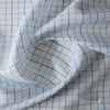 Summer Blues Check 100% Linen Fabric featuring fine blue checks on a white background, ideal for a variety of summer garments