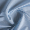 Light Blue & White Stripe Linen Blend Fabric with soft, pale blue and white vertical stripes, perfect for Summer garments like oversized shirts, dresses, tops, lightweight pants, and shorts. Slightly worn feel, may require lining due to pale color.