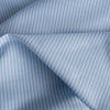 Light Blue & White Stripe Linen Blend Fabric with soft, pale blue and white vertical stripes, perfect for Summer garments like oversized shirts, dresses, tops, lightweight pants, and shorts. Slightly worn feel, may require lining due to pale color.