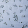 Soft green foliage patterns on white Leafy Whisper Linen Blend Fabric, 160 GSM, ideal for eco-friendly fashion and décor.