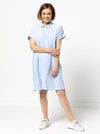 Lady wearing a blue dress made with the Blaire Dress Sewing Pattern – Shirtmaker style with shirt tail and inset pockets.