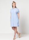 Lady wearing a blue dress made with the Blaire Dress Sewing Pattern – Shirtmaker style with shirt tail and inset pockets.