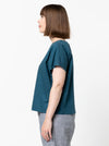 Lady wearing teal linen top made using Bonnie Woven Tops Multi-Size Sewing Pattern