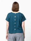 Lady wearing teal linen top made using Bonnie Woven Tops Multi-Size Sewing Pattern