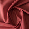 Vibrant brick red linen-cotton blend fabric, perfect for versatile sewing projects