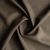 Close-up image of Burnt Umber 100% Linen Fabric, highlighting its substantial weight and rich dark brown color, ideal for various sewing projects.