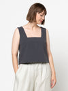 Image of the Byron Woven Top sewing pattern, highlighting the square neck, sleeveless design, and deep hem facing with topstitching, suitable for various elegant fabrics.