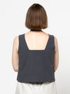 Image of the Byron Woven Top sewing pattern, highlighting the square neck, sleeveless design, and deep hem facing with topstitching, suitable for various elegant fabrics.