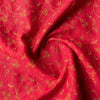 Elegant deep red linen fabric with dark golden floral embroidery, perfect for sophisticated projects.