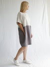 front view of women wearing linen eme dress made using Eme Dress sewing pattern by Style Arc, featuring a loose-fitting cocoon shape, perfect for summer, and suitable for linen, rayon, silk, cotton, and fine wool fabrics.