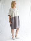 front view of women wearing linen eme dress made using Eme Dress sewing pattern by Style Arc, featuring a loose-fitting cocoon shape, perfect for summer, and suitable for linen, rayon, silk, cotton, and fine wool fabrics.