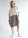 front view of women wearing linen eme dress made using Eme Dress sewing pattern by Style Arc, featuring a loose-fitting cocoon shape, perfect for summer, and suitable for linen, rayon, silk, cotton, and fine wool fabrics.