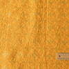 Luxurious golden mustard linen fabric with intricate embroidery and embellishments