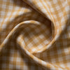 Honey yellow and white woven checks on lightweight Honey Gingham 100% Linen Fabric, with a smooth hand and subtle slubs