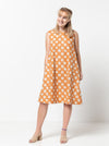 Lena Shift Dress sewing pattern, featuring a sleeveless “A” line boat neck design with a tent shape, calf length, and large inseam pockets, suitable for linen, cotton, and crepe fabrics.