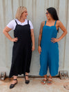 A casual Mildred jumpsuit sewing pattern with shoulder straps and wide legs, suitable for linen, cord, and denim fabrics.