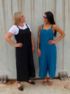 A casual Mildred jumpsuit sewing pattern with shoulder straps and wide legs, suitable for linen, cord, and denim fabrics.