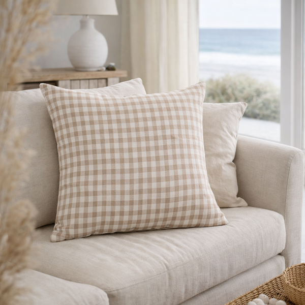 Nature Gingham on a beige sofa with a window and lamp in the background