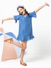 Fun and flirty Pixie Teens Dress sewing pattern featuring an easy-fit A-line shape, short flounce sleeves, hem flounce, and a ‘V’ neck, ideal for various woven fabrics