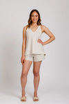 A versatile sewing pattern for a relaxed-fit camisole with a v-neck and crossover yoke, paired with comfy shorts featuring an elastic waist and pockets, perfect for lightweight summer fabrics