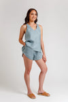 A versatile sewing pattern for a relaxed-fit camisole with a v-neck and crossover yoke, paired with comfy shorts featuring an elastic waist and pockets, perfect for lightweight summer fabrics