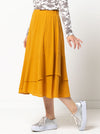 Fashion-forward Sorrento Skirt sewing pattern displaying an ‘A’ line shape with double angled flounces, designed for washed linen, silk, rayon, or knit fabrics