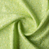 legant Sunny Lime Embroidered linen fabric with a chambray texture and green vine embroidery, ideal for sophisticated creations.