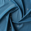 Blue Heritage Emblem Giza Cotton Blend Fabric with small embroidered logos on deep blue background