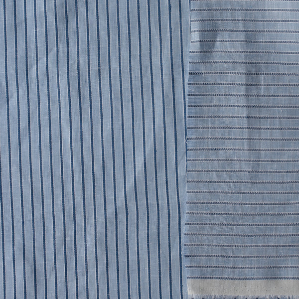 Close-up of Bluehaven Pinstripe linen fabric in pale blue with fine navy pinstripes, 100% linen, 140 GSM, 60 LEA yarn dyed