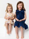 two kids wearing dress made using Bonnie Kids Dress Sewing Pattern - A-line swing dress with frill hem and sleeves, Peter Pan collar, for kids ages 2-14, suitable for woven fabrics like linen, cotton, and rayon