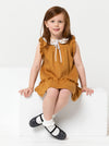 A child wearing dress made using Bonnie Kids Dress Sewing Pattern - A-line swing dress with frill hem and sleeves, Peter Pan collar, for kids ages 2-14, suitable for woven fabrics like linen, cotton, and rayon