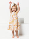 A child wearing dress made using Bonnie Kids Dress Sewing Pattern - A-line swing dress with frill hem and sleeves, Peter Pan collar, for kids ages 2-14, suitable for woven fabrics like linen, cotton, and rayon