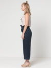 Clare Pant Sewing Pattern with wide leg, elastic waist, tie belt, angled pockets, and front pleats, perfect for fabrics like linen, crepe, or fine wool