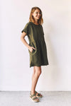 lady wearing green linen dress made using Fawn Dress Set Sewing Pattern - Versatile Dresses with Pockets in Two Bodice Styles